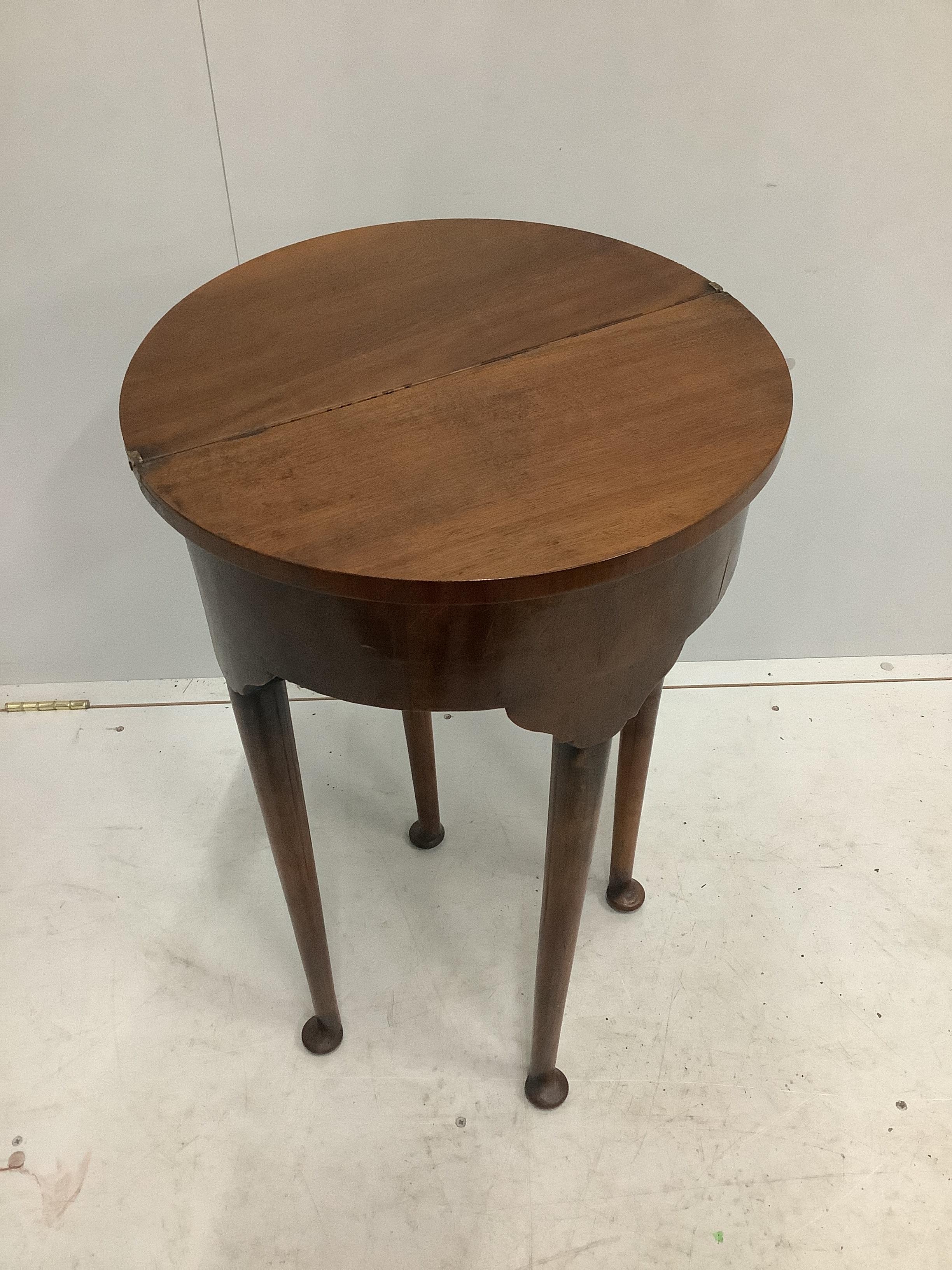 A small reproduction George III style circular topped mahogany D shaped folding table, diameter 44cm, width 22cm, height 73cm